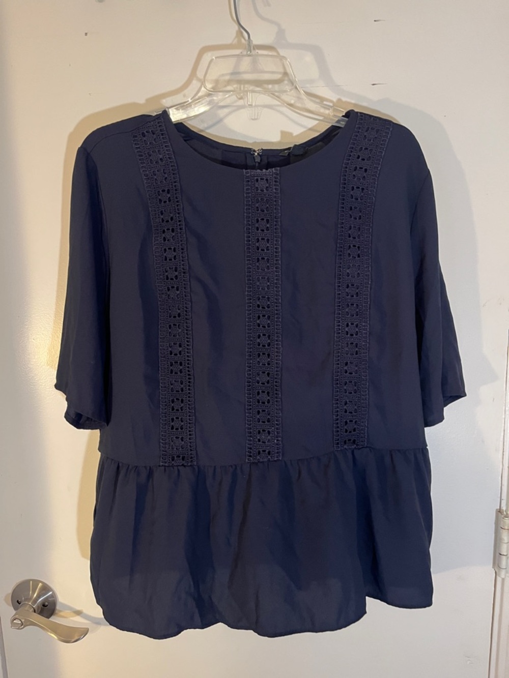 Ann Taylor, navy blue lacey peplum top, extra large with zipper back.